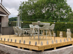 Glass balustrades surrounding dining area