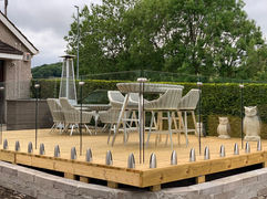Glass balustrades surrounding dining area 