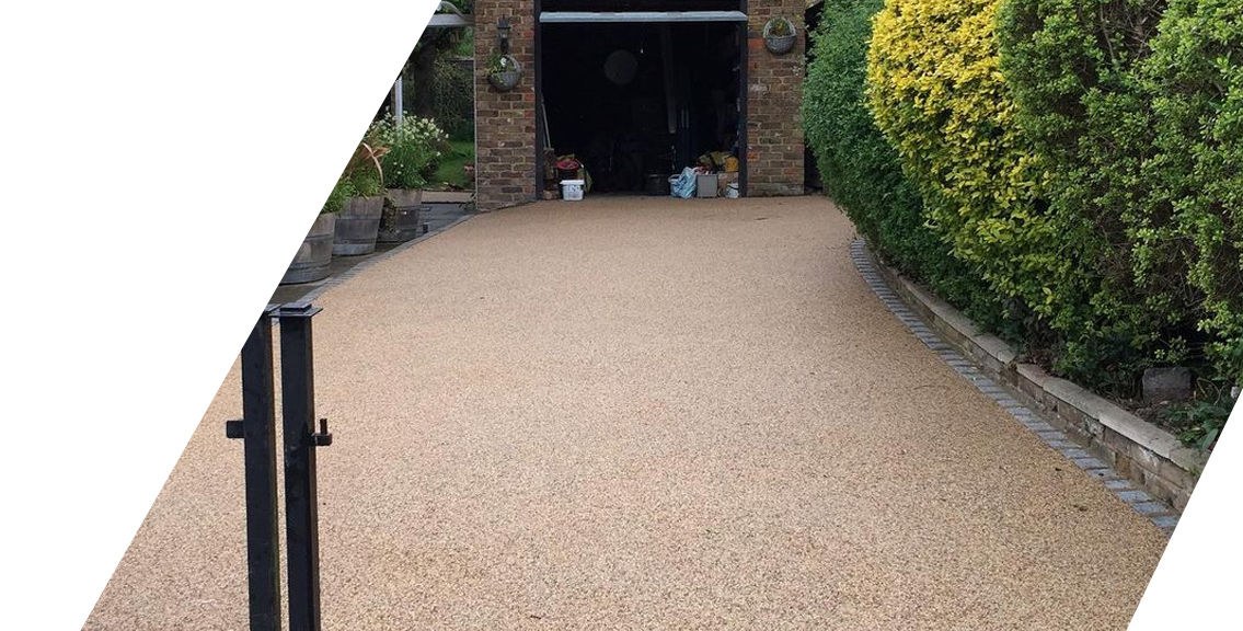 Resin driveway leading to garage