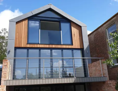 Modern home with viewing area and glass balustrades