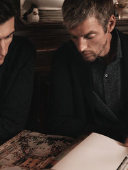 Men looking at magazine