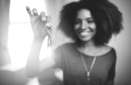 Woman holding keys up