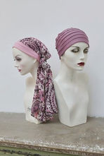 Pink headscarves on two mannequin busts