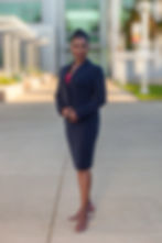 Smiling professional Black woman in a dark suit