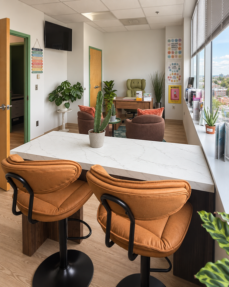 Modern office lounge with bar seating and large window