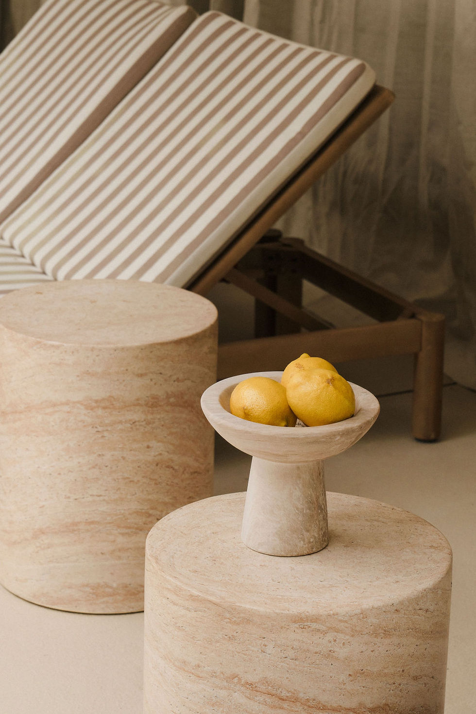 Lemons in bowl on wooden side tables
