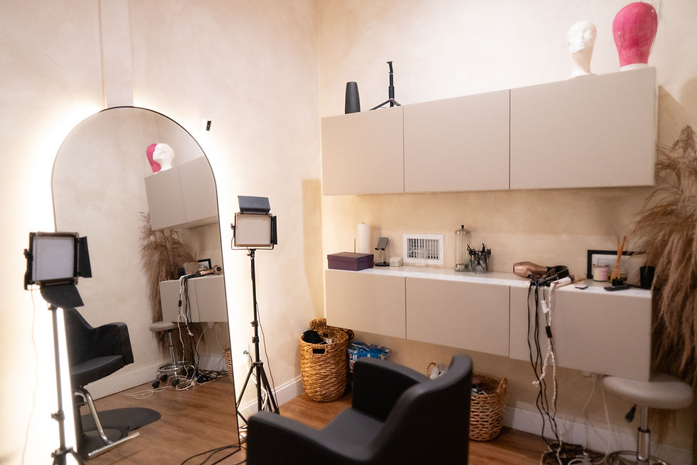 Bright salon suite featuring a styling station and dryer chair