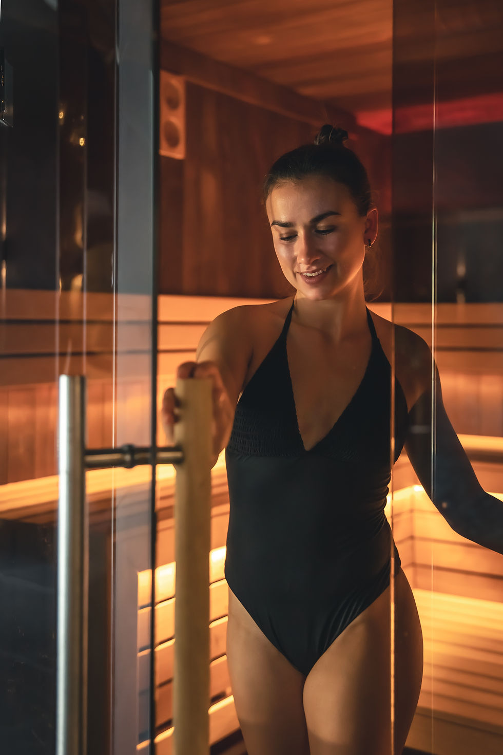 Woman smiling in a sauna room