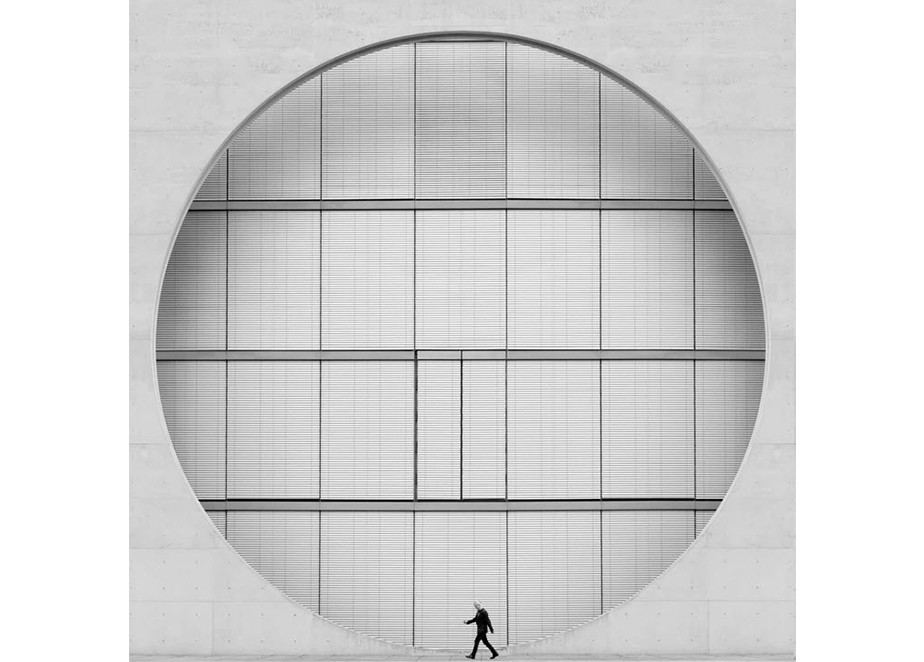 fine art photography minimalist composition black and white man passing geometrical structure