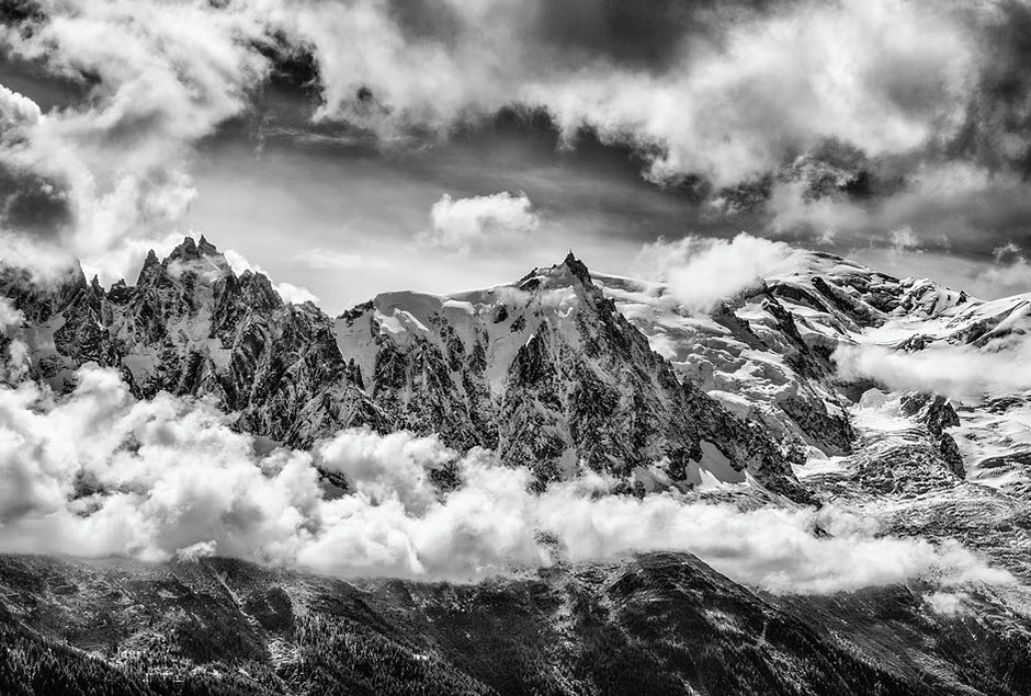 black and white landscape of mountains among the clouds