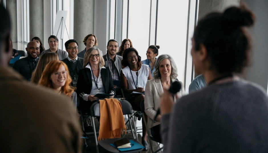 find photography networking events speaker talking to atendees