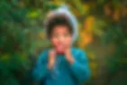 potrait photography little boy eating an apple in the forest