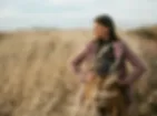 fashion photography girl standing in brown field