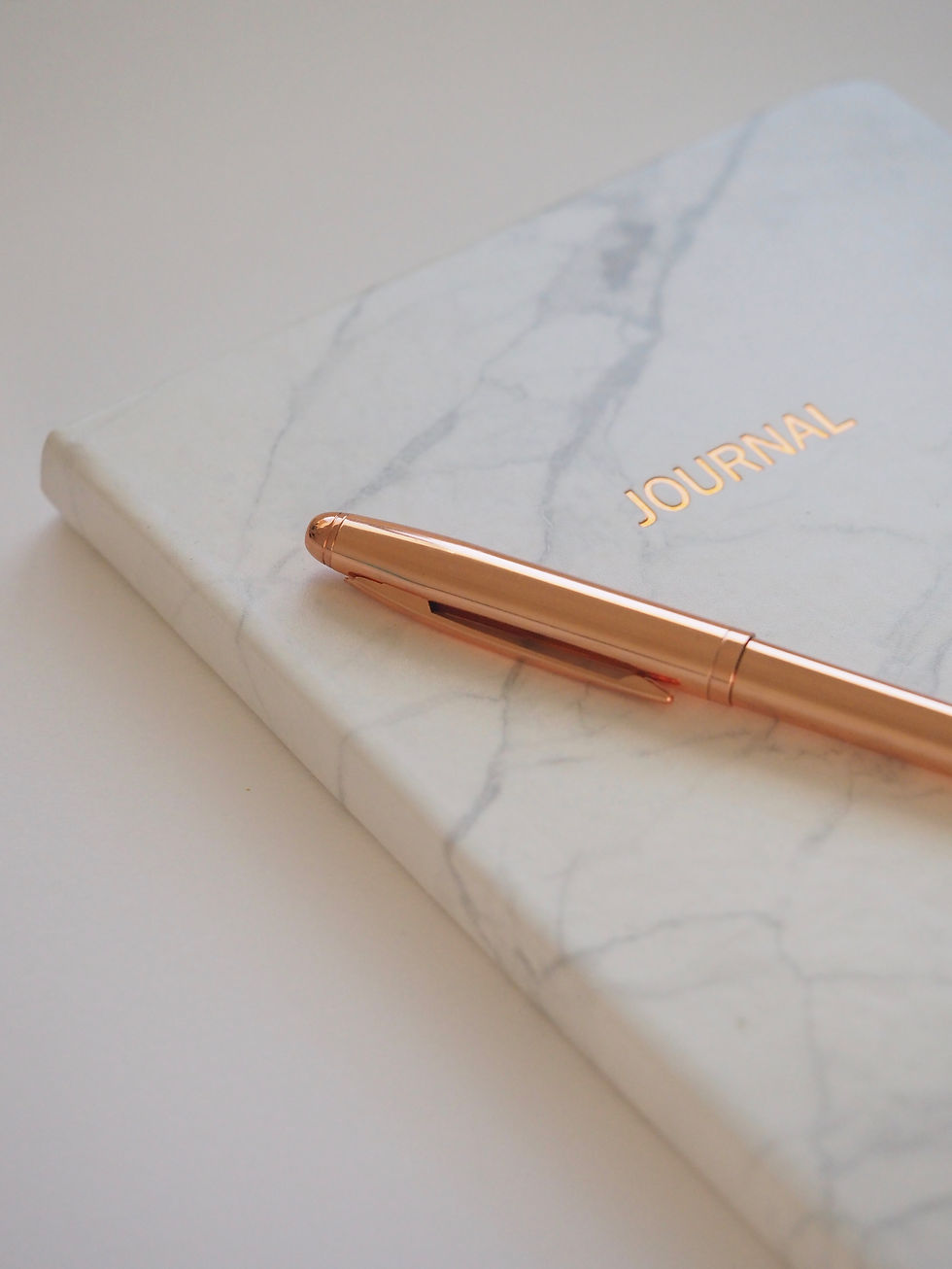 gold-pen-on-journal-book-745760