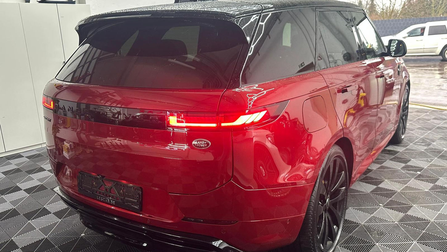 Range Rover Sport photographed from the rear angle highlighting modern LED lighting and luxury design
