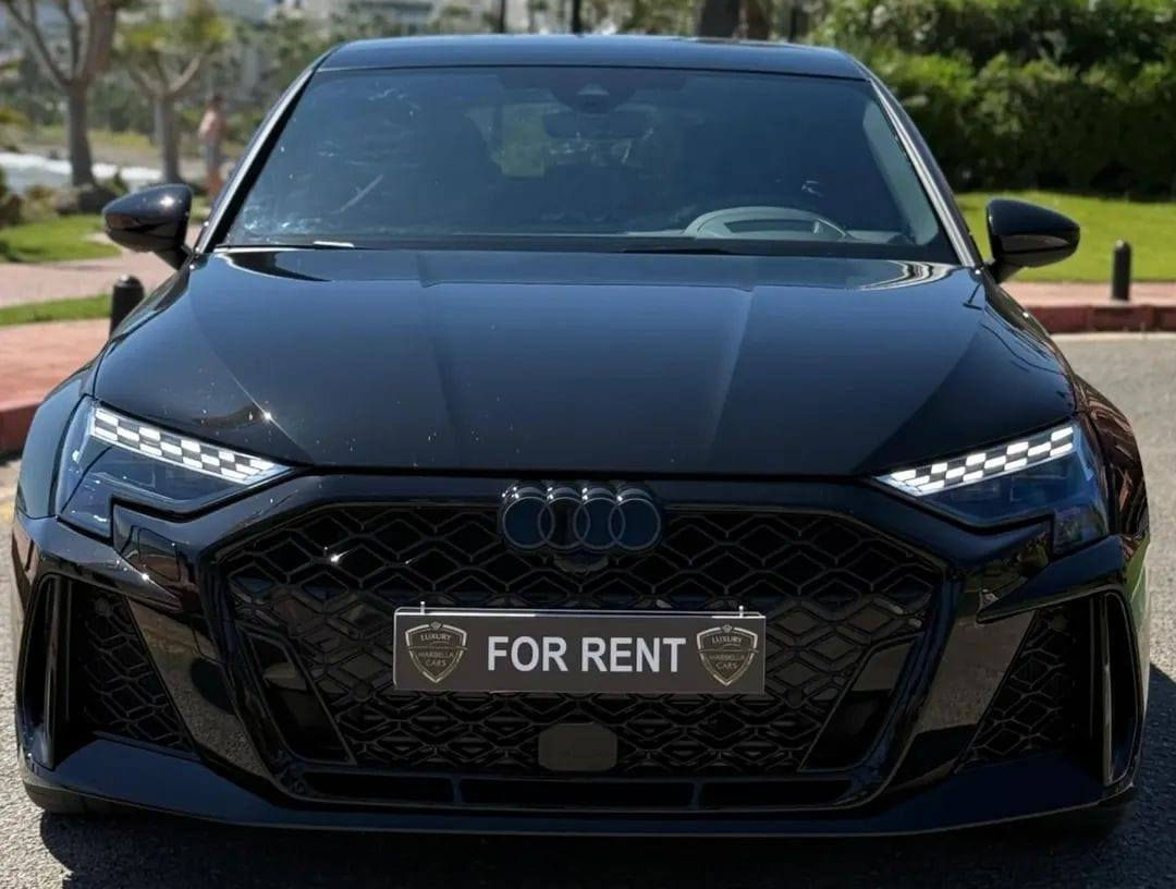 Aggressive front-end design of the Audi RS3 high-performance sedan, featuring large air intakes and LED headlights