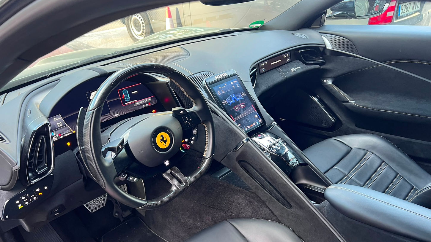 Digital dashboard and cockpit of a Ferrari Roma rental in Marbella