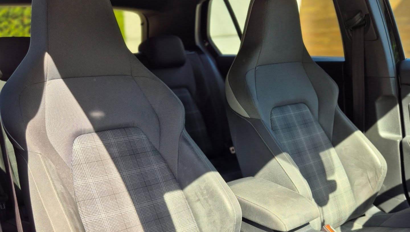 Driver cockpit of VW Golf GTD featuring multi-function steering wheel, central infotainment screen and clear instrument cluster, modern hatchback interior Marbella