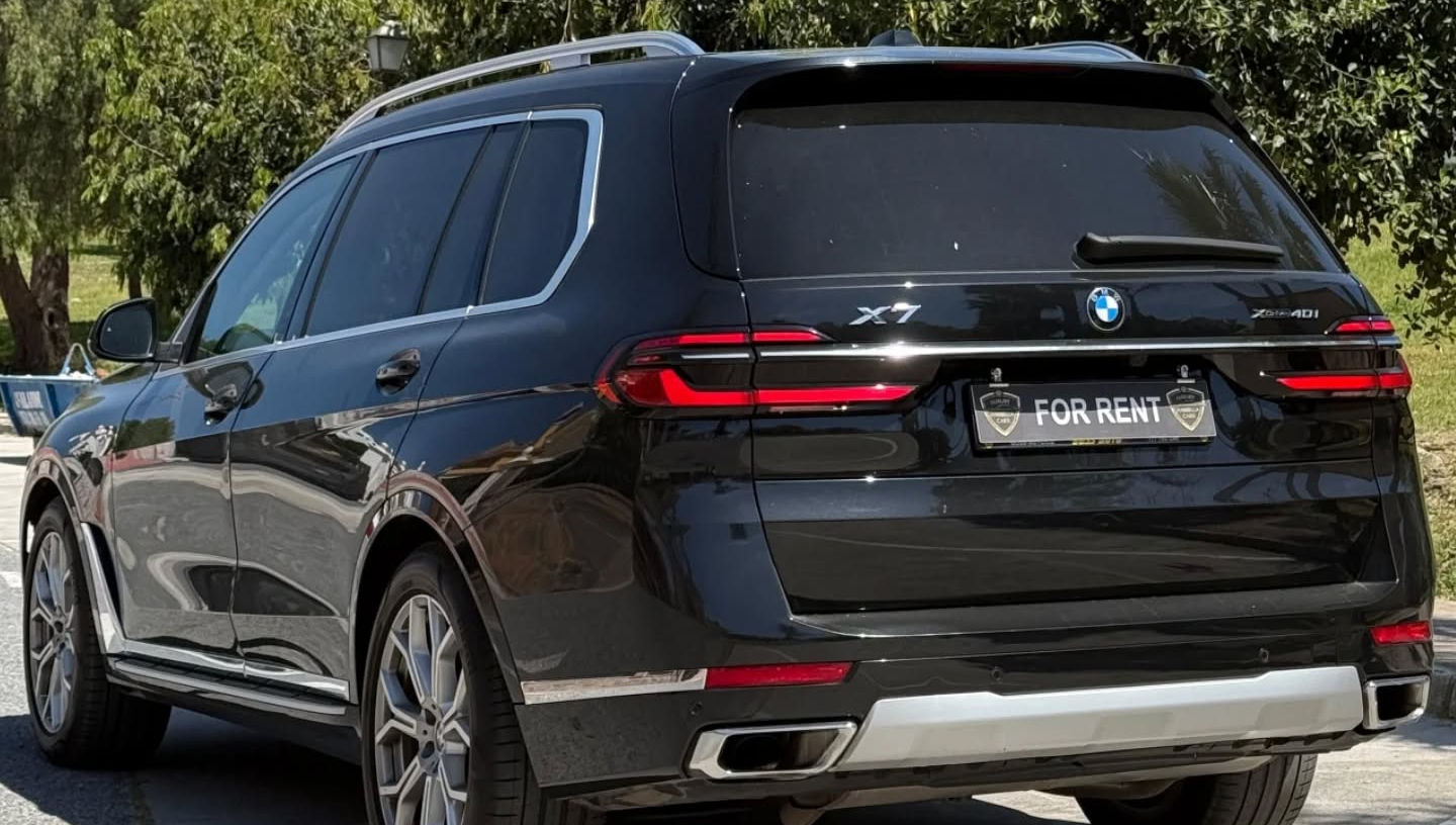 Rear left side view of BMW X7 luxury rental vehicle in Marbella