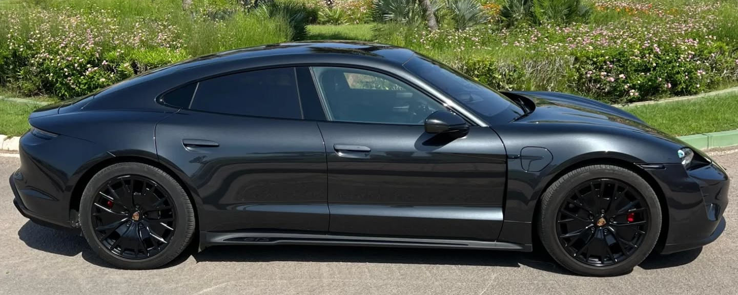 Side profile of Porsche Taycan GTS electric performance sedan in Marbella