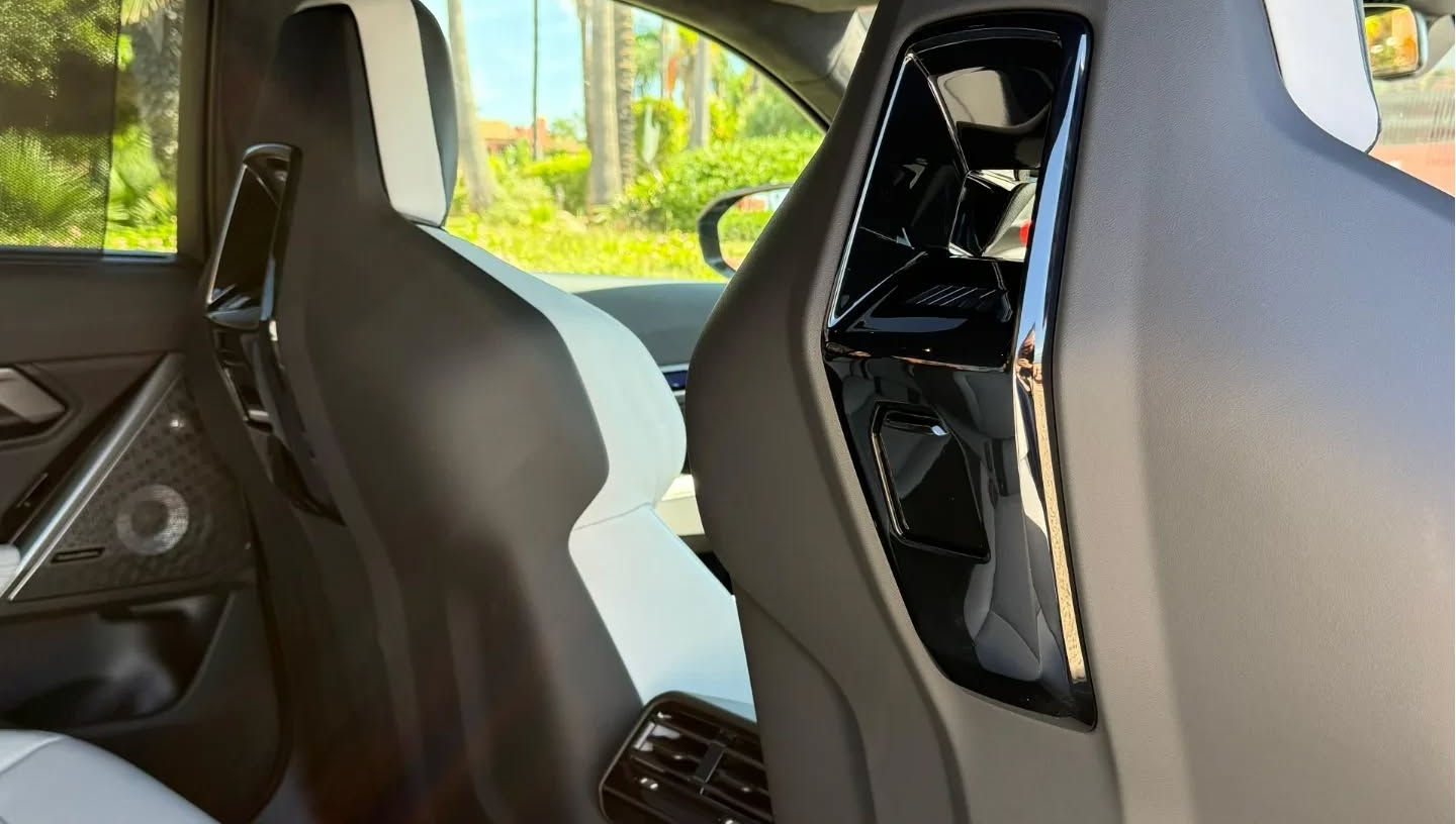 Rear-facing view of front M Sport seats revealing headrest M5 embroidery, contoured backrest profiles and premium stitching patterns in BMW M5 Competition sedan, Marbella rental