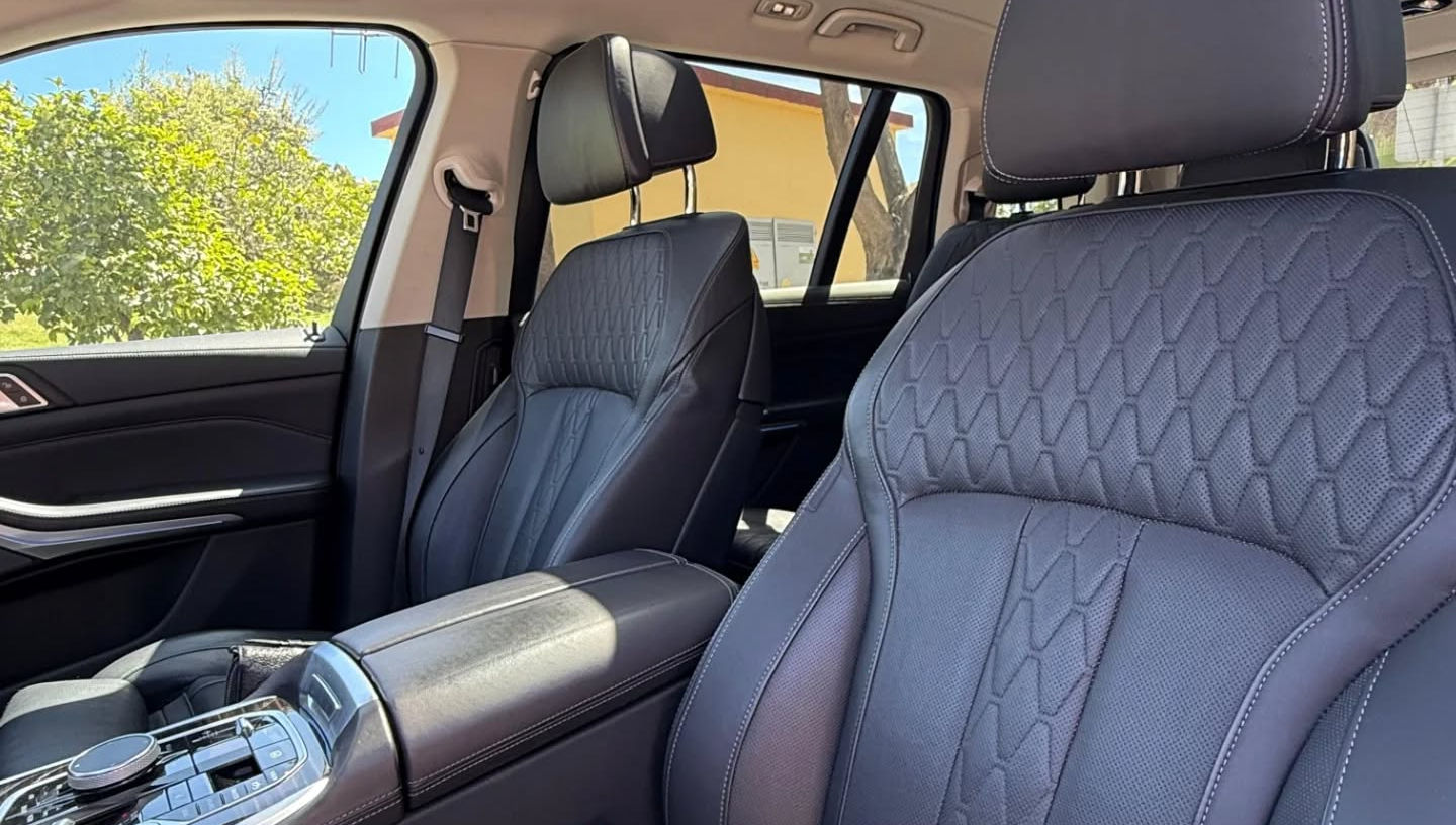 Front seats inside BMW X7 luxury SUV available for rent in Marbella