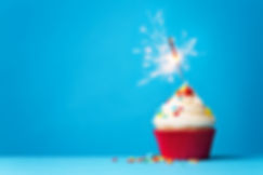 Cupcake-with-sparkler-on-blue-467704570_