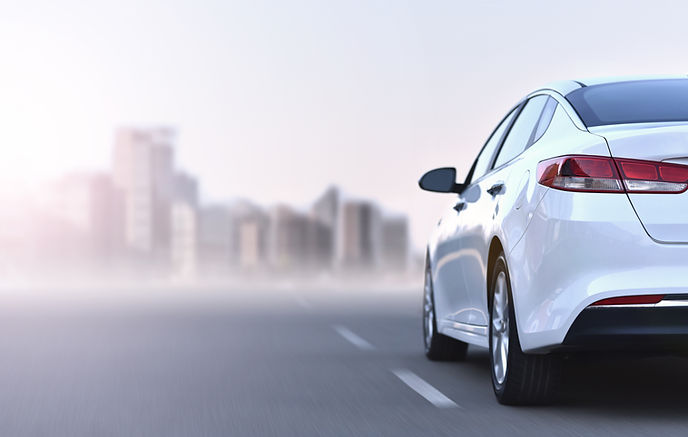 Business car on high speed is driving to financial district.jpg