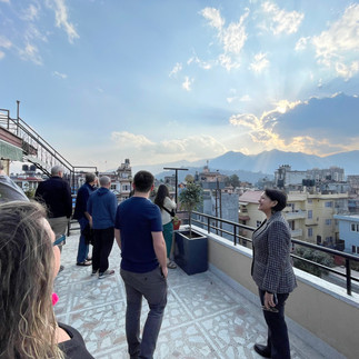 Group of people standing on a rooftop in Nepal