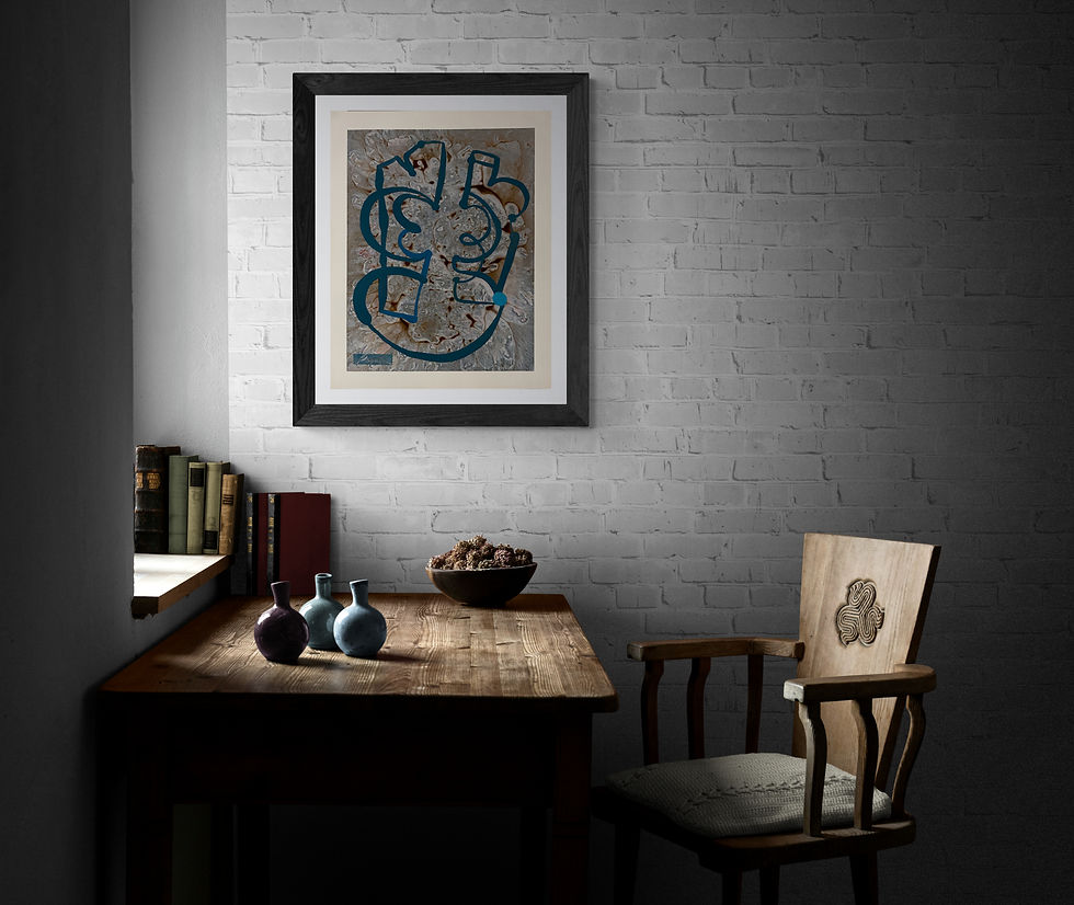 Ralph Paquin's abstract painting 'Tantalum Depleting' from the 'Elemental Matter' series, framed and displayed on a white brick wall in a dimly lit office. The painting features swirling blue and earthy tones, symbolizing the rare metal and its environmental impact. Below, a rustic wooden table holds two vases and a bowl, complementing an adjacent bookshelf with antique books, enhancing the room's intellectual ambiance. A wooden chair with a carved design completes the scene.