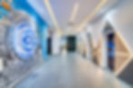 Futuristic Union Bank corridor featuring a metaverse-inspired portal installation with programmable QR codes, symbolizing the future of finance —designed by Spacefinish—blending spatial storytelling with a forward-thinking fintech identity.