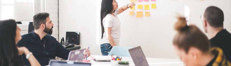 woman placing sticky notes on wall_edite