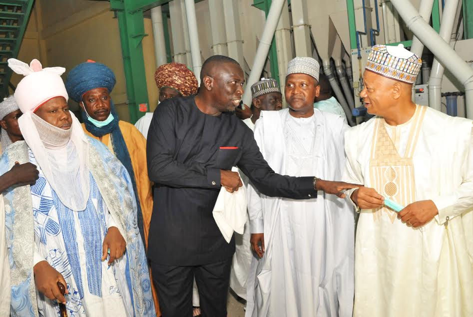 L-R, Dan Majen Kano, District Head of Gwale, Alh. Yahya Inuwa Abbas, Representative of Emir of Kano, Chiarman Dangote Flour Mills PLC , Ighodalo Asue, President \ Chief Executive Dangote Group, Aliko Dangote,Managing Director of Dangote Flour Mills PLC ,Thabo Mabe During the Tour of the Plant, at the Official RE-OPENING of Dangote Flour Mills PLC, Kano Mill. Kano State