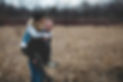 woman carried on the back of a man, both having fun