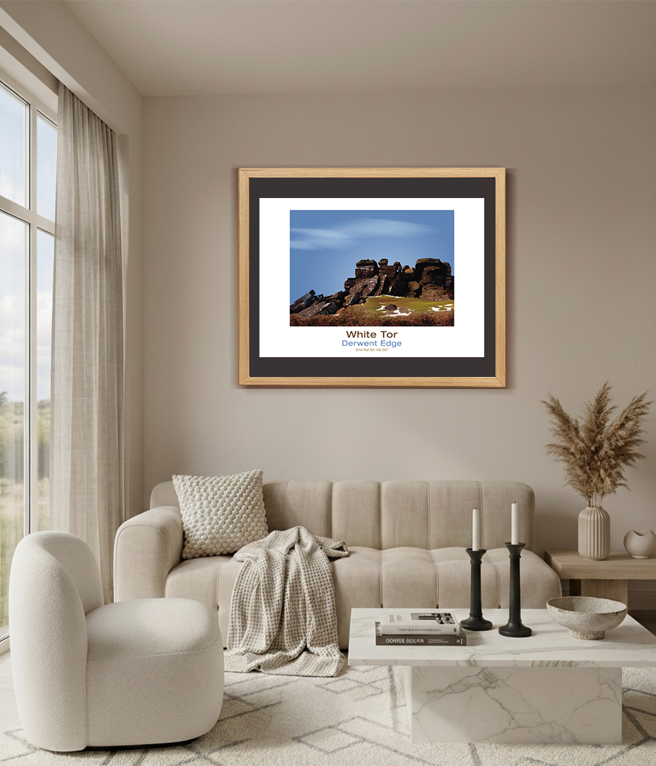 Thumbnail: Framed White Tor rocky landscape photo, above a sofa in a living room