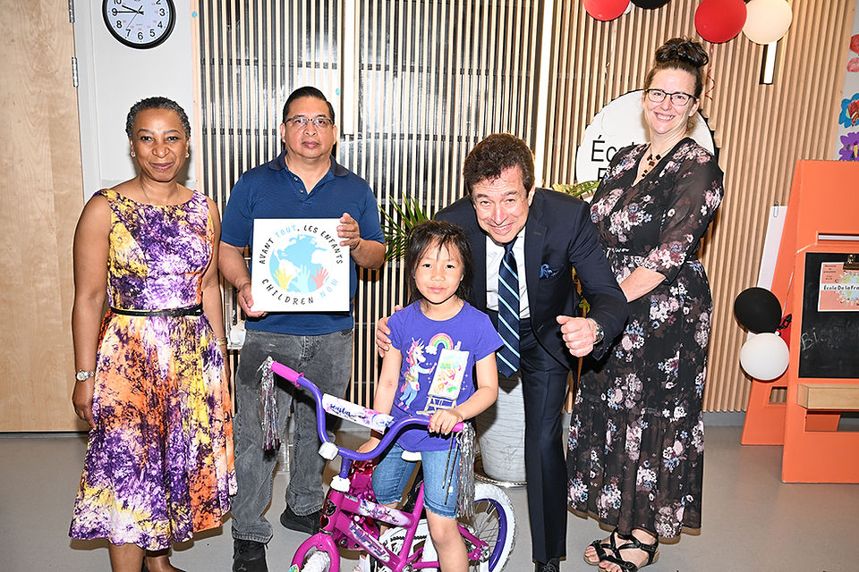 Child happy to receive a new bike