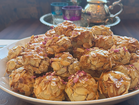 Handmade Moroccan almond biscuits with a traditional tea set at Café Marrakech in Canterbury