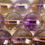 Thumbnail: Ametrine Polished Round Beads Strand - Strand of polished round ametrine beads with a mix of amethyst purple and citrine gold