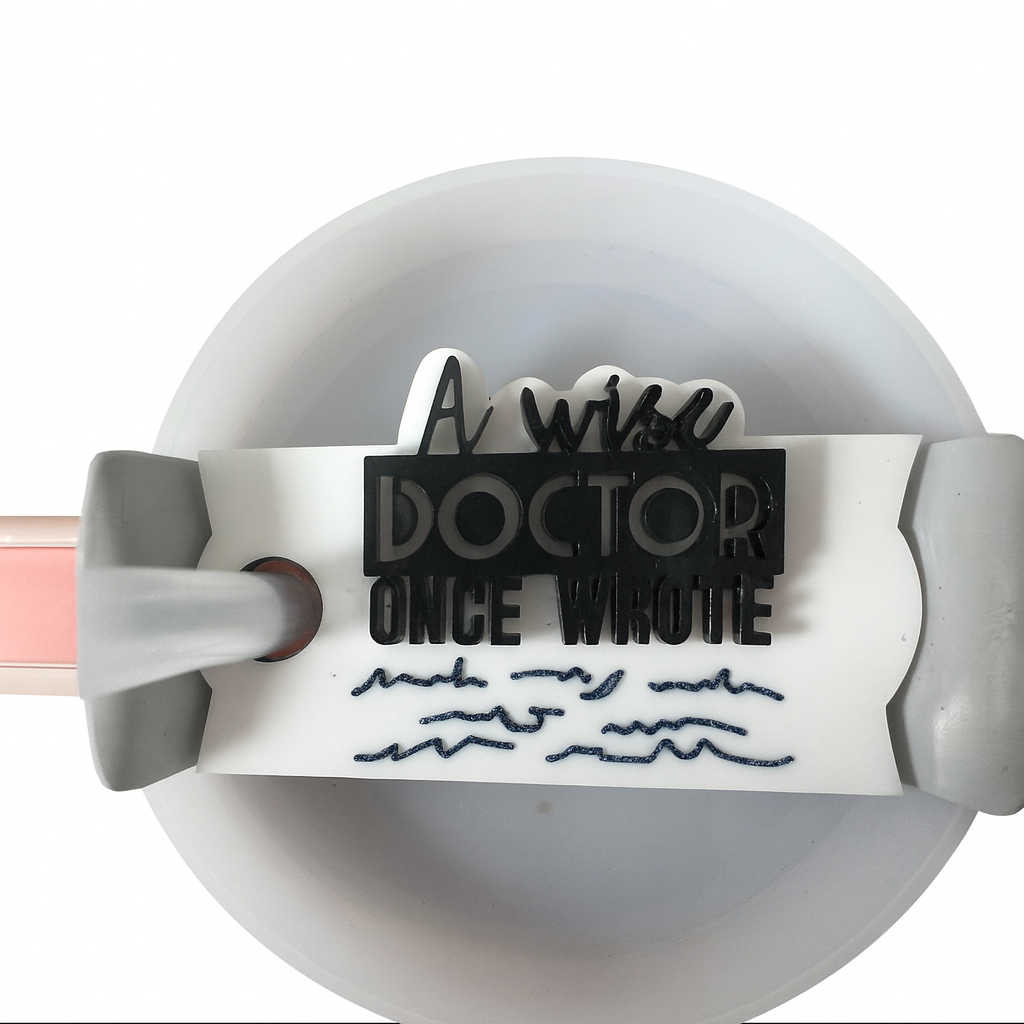 A Wise Doctor Once Wrote” acrylic Stanley topper on tumbler, available in 30oz and 40oz sizes.