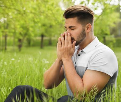 Hay fever symptoms itchy eyes sneezing pollen summer UK