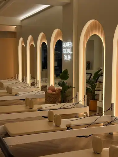 Row of lit arches above the reformers