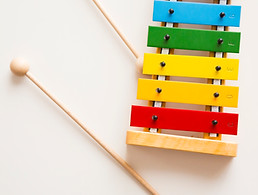 small multicolour xylophone and two beaters
