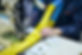 Industrial sewing machine sews a webbing sling. Manufacture of textile slings and tie stra