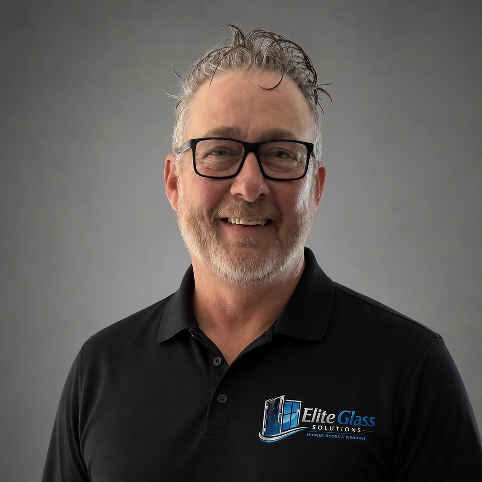 David Gray, CEO of Elite Glass Solutions, smiling in a professional portrait.