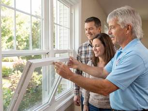 Eddie demonstrating the tilt-in feature on new energy efficient windows