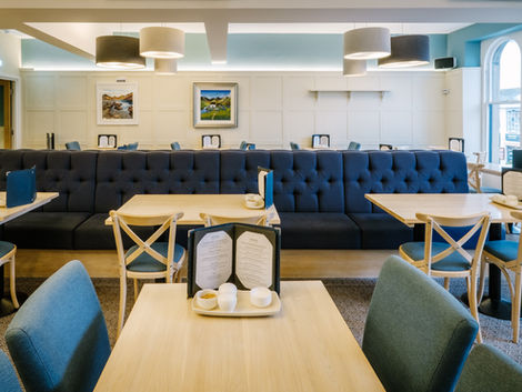 Bryson's tearoom seating with tables and dark blue bench seating