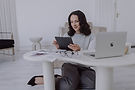hannah-julia-marketing-reviewing-tablet-at-desk.jpg