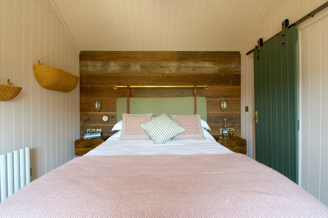 Cozy bedroom interior at Basecamp North Lakes cabin.