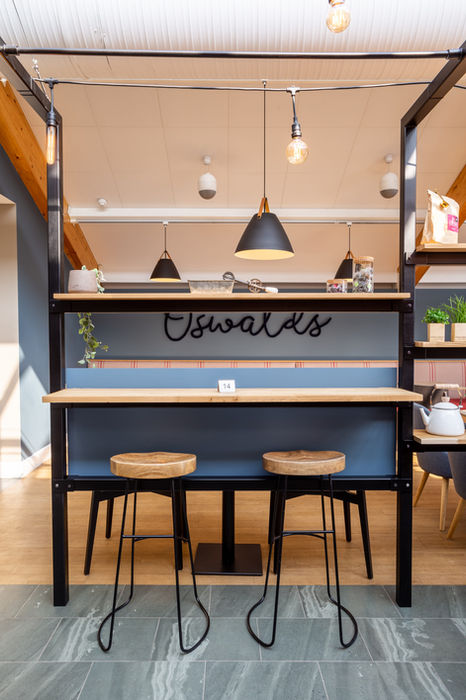 High top wooden seating at Cafe Oswalds in Cranstons Penrith Foodhall