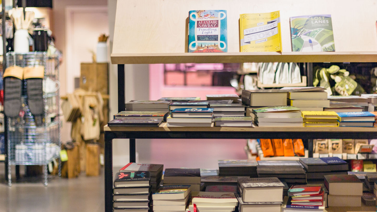 Books on shelving display in Gloucester Services farm shop